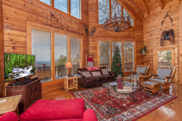 Couch and two glider rockers in the living room at The Original American Dream, a 2 bedroom cabin rental located in Gatlinburg