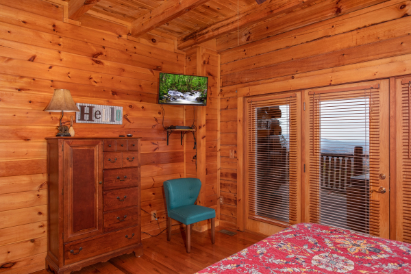 Television in the master bedroom at The Original American Dream, a 2 bedroom cabin rental located in Gatlinburg