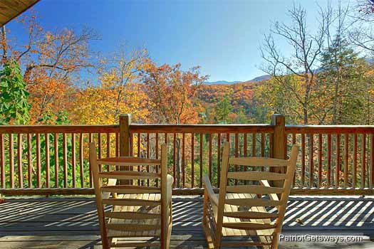 Rocking chairs overlooking the fall colors at Precious View, a 1 bedroom cabin rental located in Gatlinburg