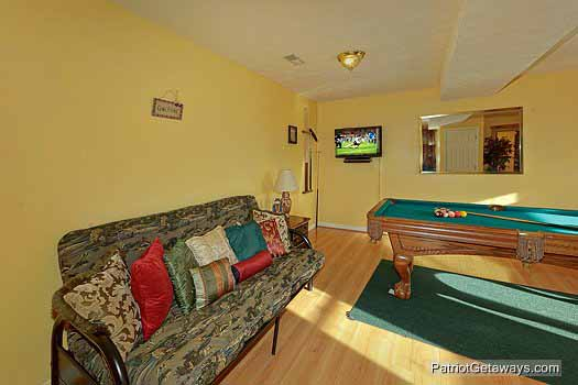 Game room with futon at Sunset Vista View, a 1 bedroom cabin rental located in Pigeon Forge
