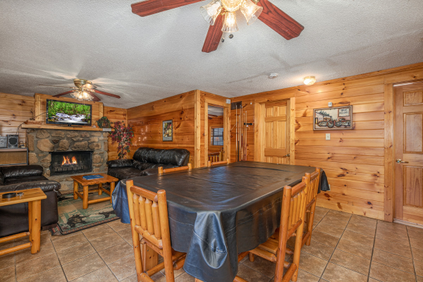 Pool table in the dining space at Pine Splendor, a 5 bedroom cabin rental located in Pigeon Forge