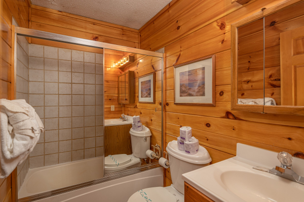 Bathroom with a tub and shower at Pine Splendor, a 5 bedroom cabin rental located in Pigeon Forge