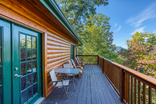 Deck on the second level at Pine Splendor, a 5 bedroom cabin rental located in Pigeon Forge