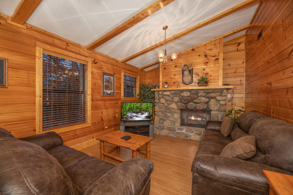 Second living room with fireplace & tv at Pine Splendor, a 5 bedroom cabin rental located in Pigeon Forge