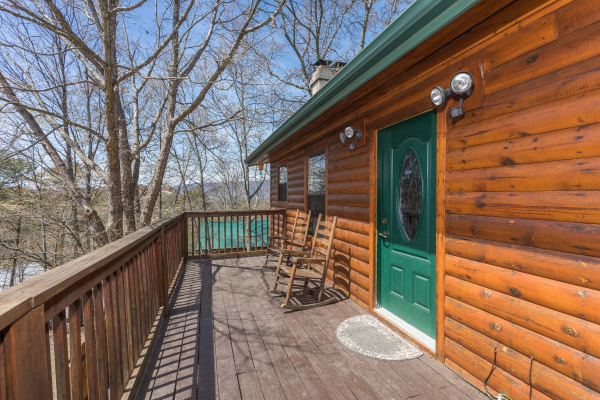 Second floor deck with wooded surrounding at Pine Splendor, a 5 bedroom cabin rental located in Pigeon Forge