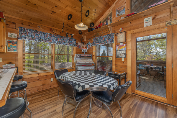 Dining table at Rock Around the Clock, a 1 bedroom cabin rental located in Pigeon Forge