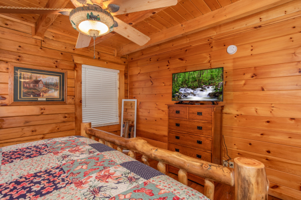Dresser and TV in a bedrooom at The Cowboy Way, a 4 bedroom cabin rental located in Pigeon Forge