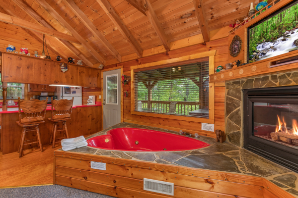 Heart shaped jacuzzi tub and dining space at Loving You, a 1 bedroom cabin rental located in Pigeon Forge