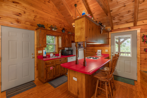Kitchen and dining space at Loving You, a 1 bedroom cabin rental located in Pigeon Forge