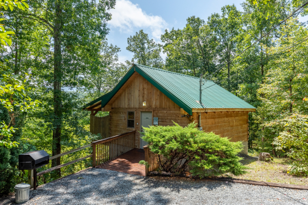 Parking area with grill and cabin entrance at Loving You, a 1 bedroom cabin rental located in Pigeon Forge