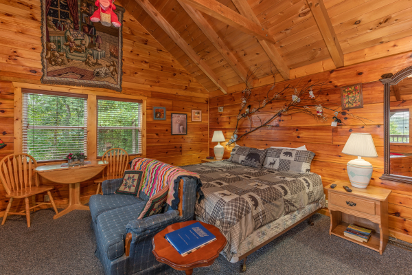 Studio style living room with bed and dining space at Loving You, a 1 bedroom cabin rental located in Pigeon Forge