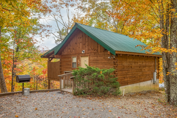 Cabin exterior and flat parking at Love Me Tender, a 1 bedroom cabin rental located in Pigeon Forge