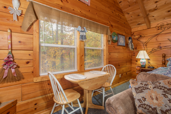 Dining table for two at Love Me Tender, a 1 bedroom cabin rental located in Pigeon Forge