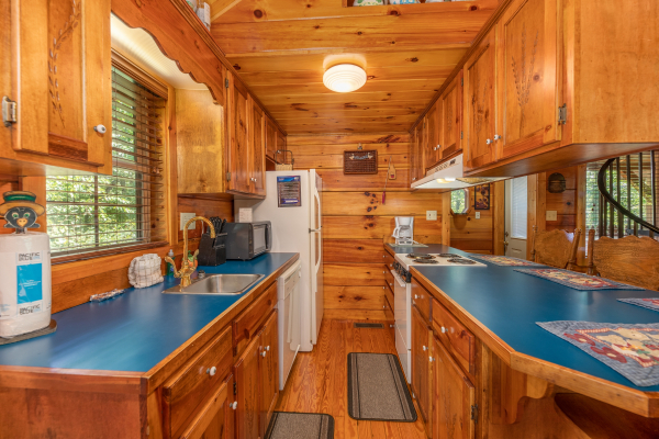 Galley kitchen at Just Us, a 1 bedroom cabin rental located in Pigeon Forge