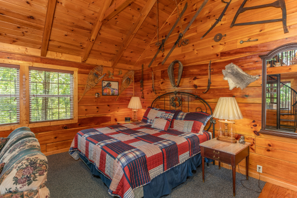 King sized bed at Just Us, a 1 bedroom cabin rental located in Pigeon Forge