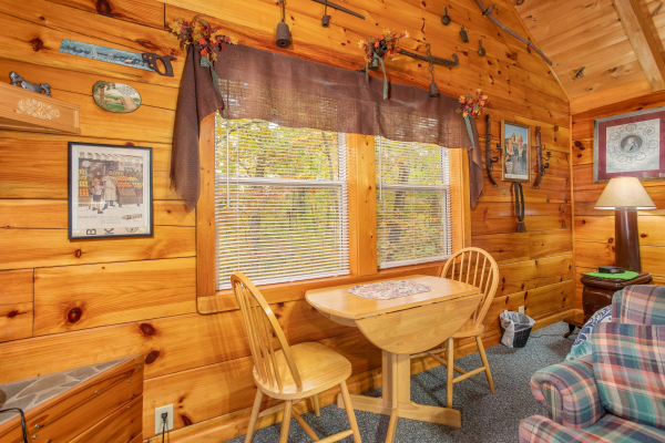 Dining table for two at All Shook Up, a 1 bedroom cabin rental located in Pigeon Forge