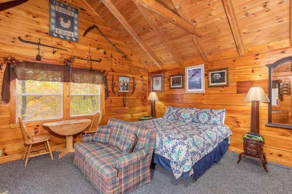 Studio concept with dining space bed and love seat at All Shook Up, a 1 bedroom cabin rental located in Pigeon Forge
