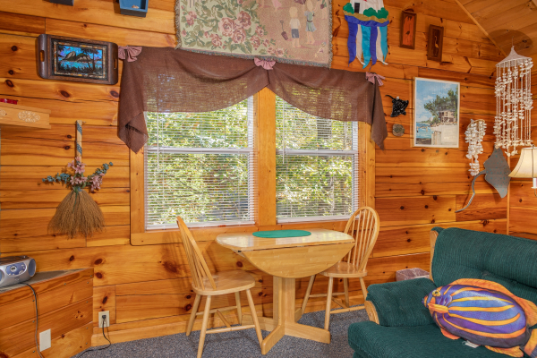 Dining table for two in the studio space at Forever Yours, a 1-bedroom cabin rental located in Pigeon Forge