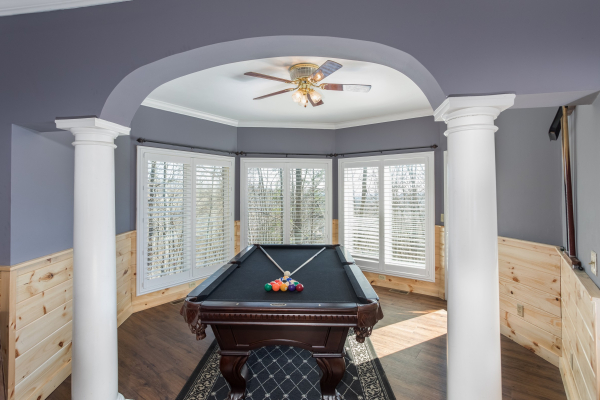 Pool table in a nook at The Majestic, an 8 bedroom cabin rental located in Gatlinburg