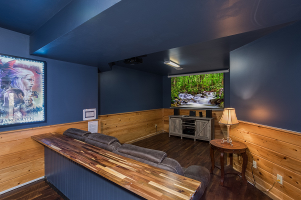 Theater room with counter and sofa seating at The Majestic, an 8 bedroom cabin rental located in Gatlinburg