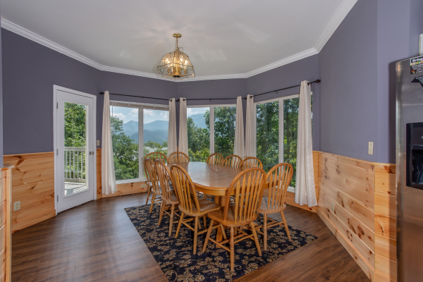 Dining space for 10 at The Majestic, an 8 bedroom cabin rental located in Gatlinburg
