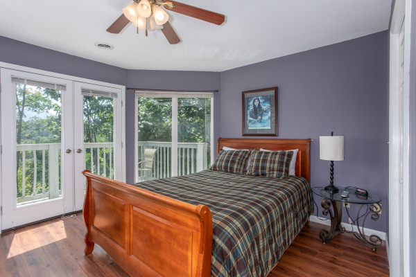 Bedroom with a sleigh bed at The Majestic, an 8 bedroom cabin rental located in Gatlinburg