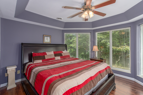 Bedroom with a king bed at The Majestic, an 8 bedroom cabin rental located in Gatlinburg