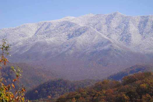 Snow-capped Smoky Mountains seen from Chalet Mignon, an 8-bedroom cabin rental located in Gatlinburg
