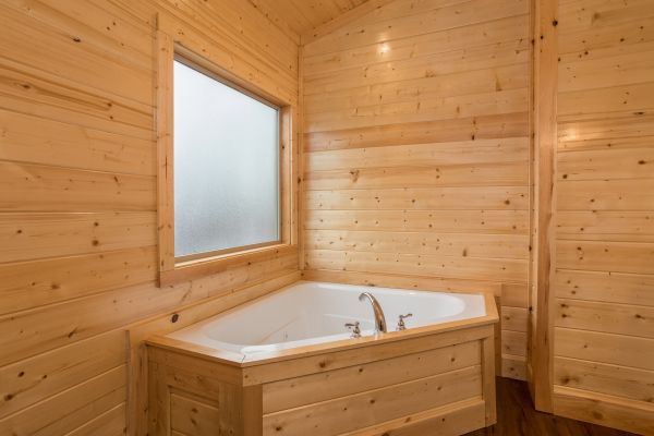 Jacuzzi in a corner at Splash Mountain Lodge a 4 bedroom cabin rental located in Gatlinburg