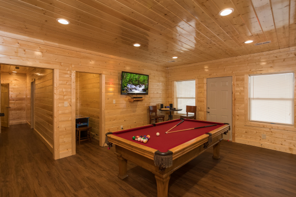 Pool table in the game room at Splash Mountain Lodge a 4 bedroom cabin rental located in Gatlinburg