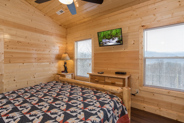 Dresser and TV in a bedroom at Splash Mountain Lodge a 4 bedroom cabin rental located in Gatlinburg