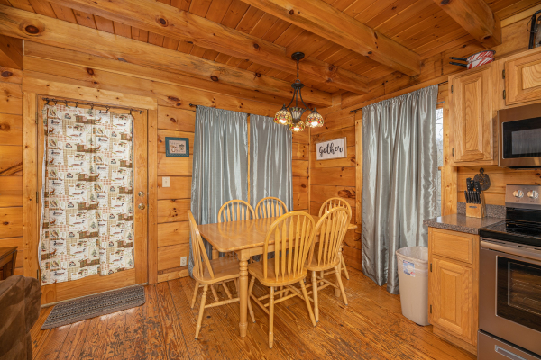 Dining table for six at Fox Ridge, a 3 bedroom cabin rental located in Pigeon Forge