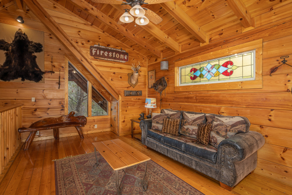 Loft with sofa at Fox Ridge, a 3 bedroom cabin rental located in Pigeon Forge