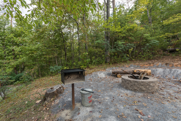 Grill and fire pit at Bird's Eye View, a 2-bedroom cabin rental located in Gatlinburg