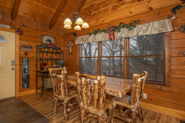 Dining space for six at Pigeon Forge Pleasures, a 3 bedroom cabin rental located in Pigeon Forge