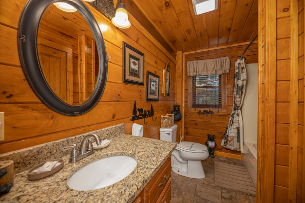 Bathroom with a tub and shower at Pigeon Forge Pleasures, a 3 bedroom cabin rental located in Pigeon Forge