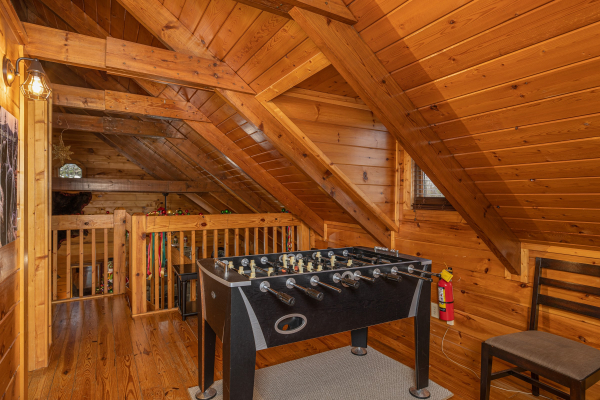 Foosball table at Pigeon Forge Pleasures, a 3 bedroom cabin rental located in Pigeon Forge