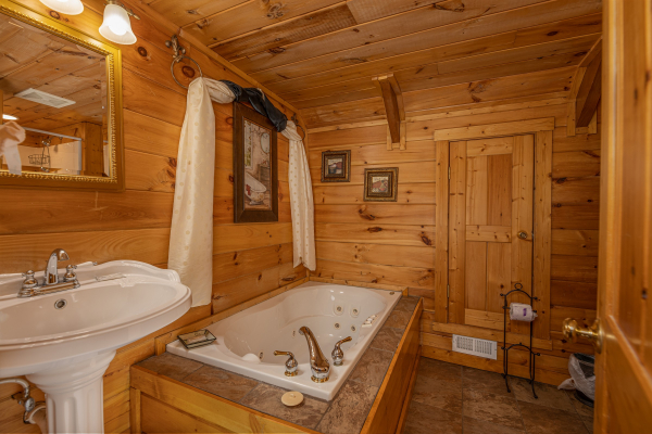 Bathroom with jacuzzi tub at Pigeon Forge Pleasures, a 3 bedroom cabin rental located in Pigeon Forge