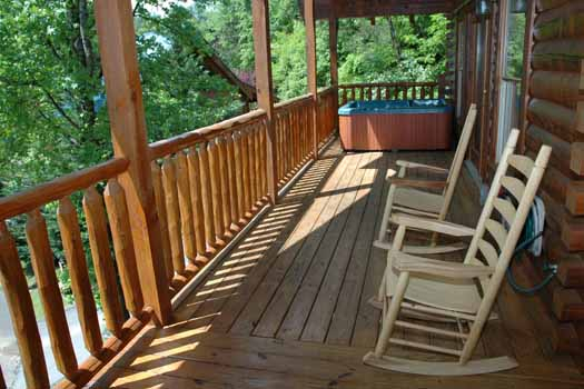 rocking chairs on the deck at alpine sondance a 2 bedroom cabin rental located in pigeon forge