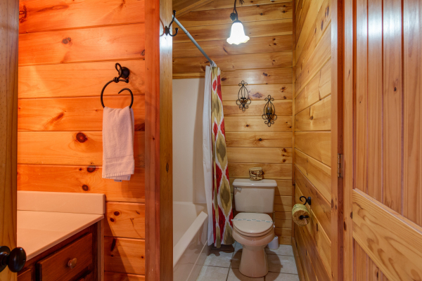 Bathroom with a tub and shower at Alpine Sondance, a 2 bedroom cabin rental located in Pigeon Forge