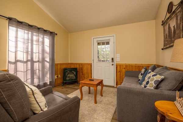 Living room seating at Liam's Lookout, a 2 bedroom cabin rental located in Pigeon Forge