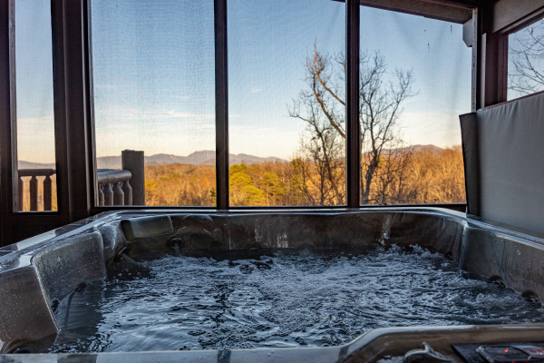 Hot tub with mountain view at Gone To Therapy, a 2 bedroom cabin rental located in Gatlinburg