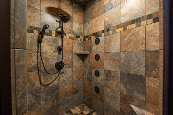 Stone shower at Gone To Therapy, a 2 bedroom cabin rental located in Gatlinburg