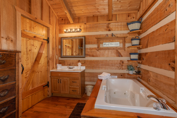 Vanity and jacuzzi tub in the bedroom at Blue Mountain Views, a 1 bedroom cabin rental located in  Pigeon Forge