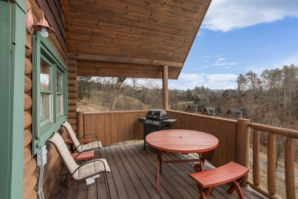 Deck seating at Hanky Panky, a 1-bedroom cabin rental located in Pigeon Forge