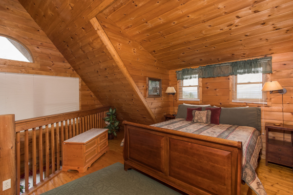 King bed in loft at Hanky Panky, a 1-bedroom cabin rental located in Pigeon Forge