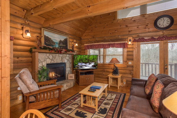 Living room with fireplace at Hanky Panky, a 1-bedroom cabin rental located in Pigeon Forge