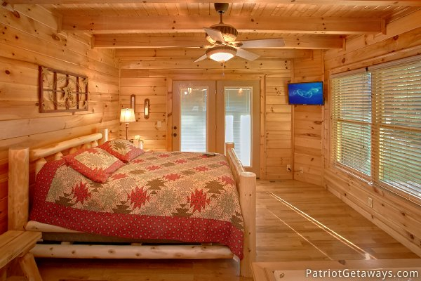 Log framed bed at Alpine Sundance Trail, a 3 bedroom cabin rental located in Pigeon Forge