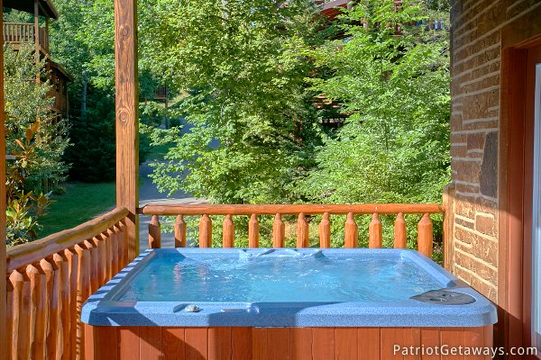 Outdoor hot tub at Alpine Sundance Trail, a 3 bedroom cabin rental located in Pigeon Forge