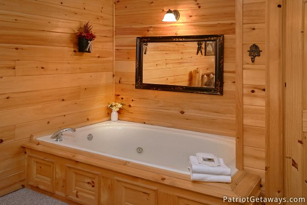 Jacuzzi tub in the bedroom on second floor at Alpine Sundance Trail, a 3 bedroom cabin rental located in Pigeon Forge